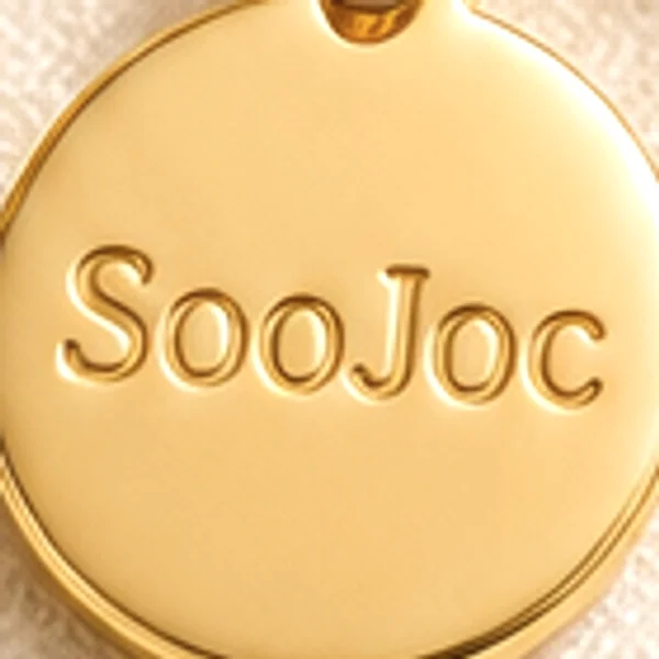 Our round charm, hand-stamped